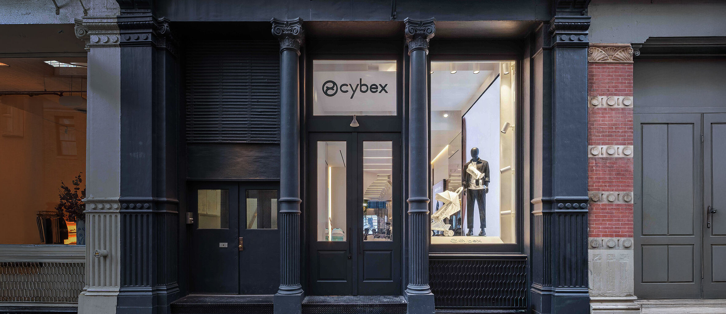 CYBEX Flagship Store New York with a mannequin and a Coya Urban Mobility lightweight stroller in the window.