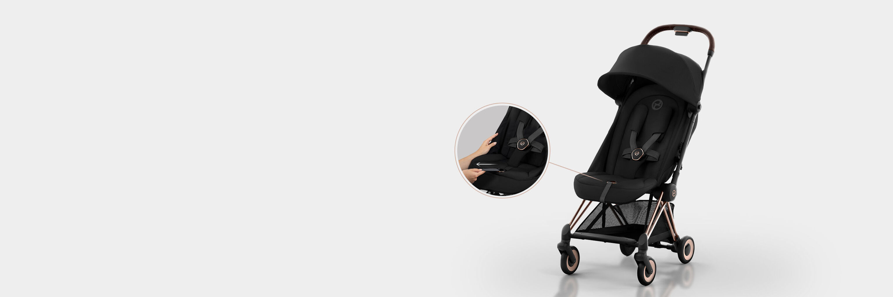 Coya compact travel stroller in black, close-up of reclining feature.