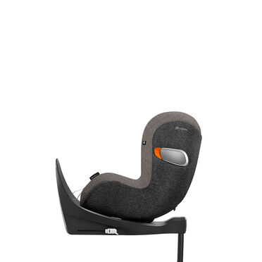 A grey Cybex child car seat mounted sideways on a black base.