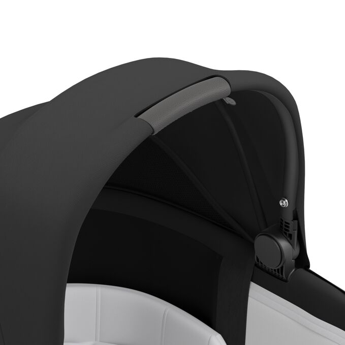 An image of the CYBEX Platinum Priam Lux Carry Cot Stroller, highlighting the Carrying Handle feature.