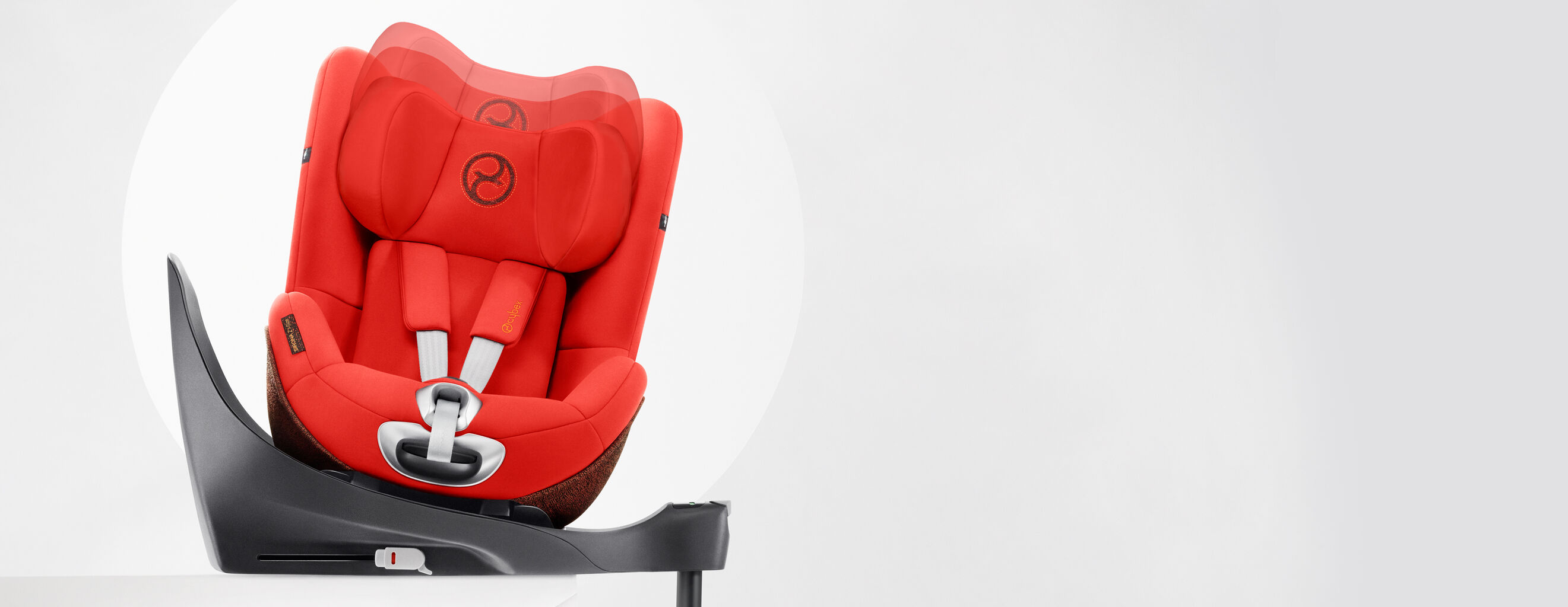 Sirona Z car seat in bright red with a rotating base against a grey background.