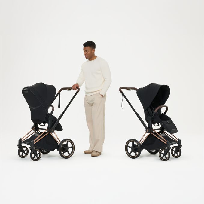 An image of the CYBEX Platinum e-Priam - Style Collection Stroller, highlighting the Reversible Seat Unit feature.