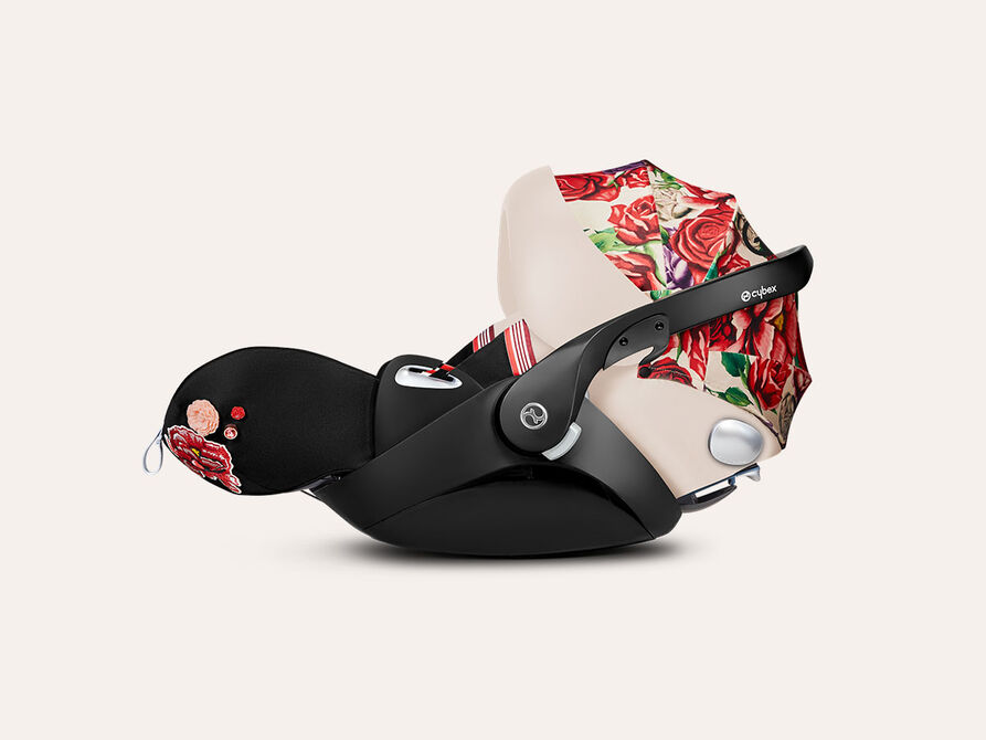 CYBEX Spring Blossom infant car seat with floral design in red and beige.