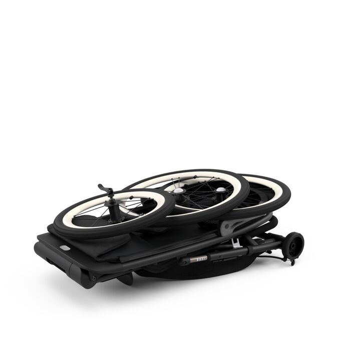 An image of the CYBEX Gold Avi One Box - PUMA Black Jogger, highlighting the Ultra-compact fold within seconds feature.