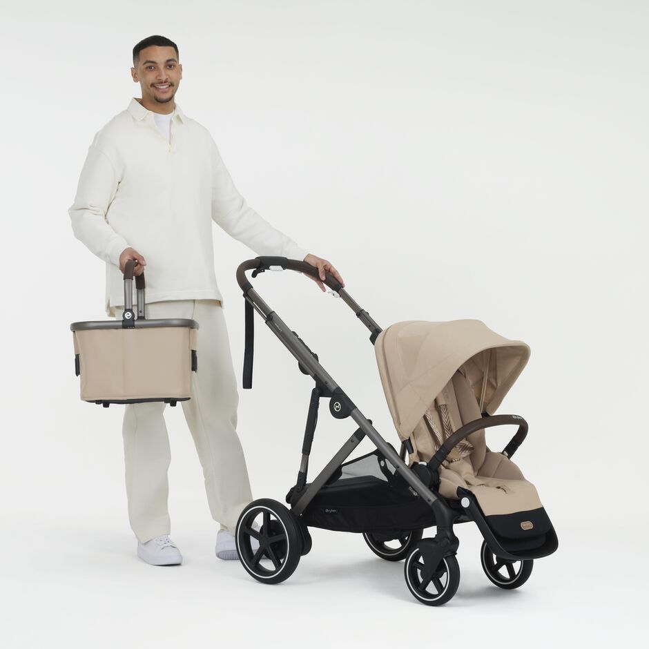An image of the CYBEX Gold e-Gazelle S Sibling Stroller, highlighting the Super-spacious Pushchair Basket feature.