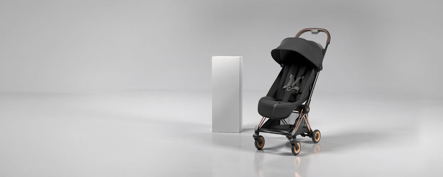Product image of a Coya with a seat unit attached and a white pillar behind it.