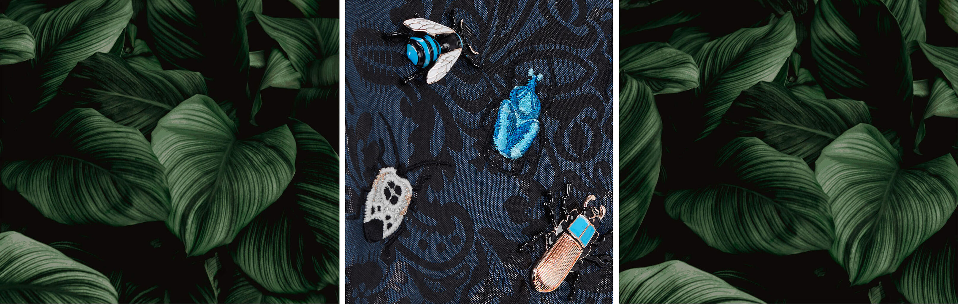 Blue fabric with embroidered insects and floral patterns, surrounded by large green leaves.