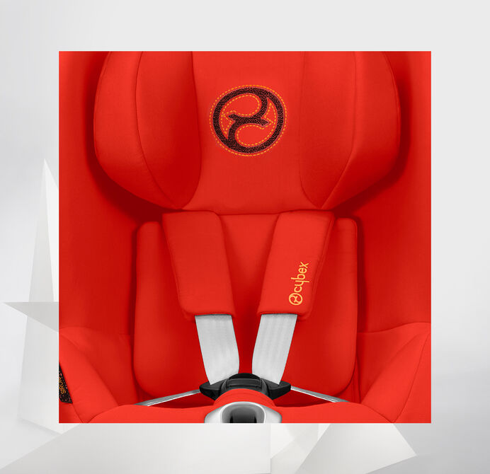 A red Cybex Sirona Z car seat with a distinctive logo on the headrest.