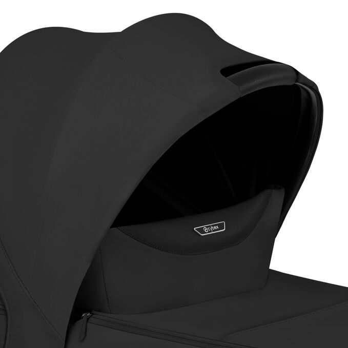 An image of the CYBEX Platinum Mios/Coya Fold Lux Carry Cot - Style Collection Stroller, highlighting the Canopy Carry Handle feature.