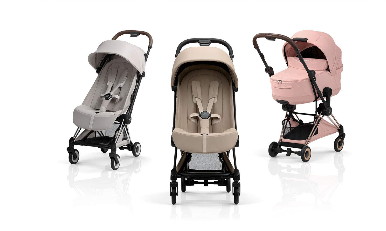Three Co&yuml;a Style buggies in different colors, two with a seat pack, one with a cot.