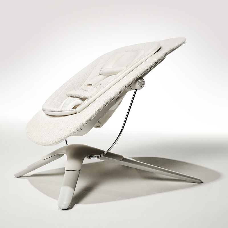 Side view of the Lemo Platinum baby bouncer, featuring sleek design and soft padding.