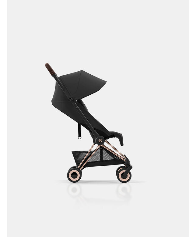 Side view of a Coya lightweight stroller on white background