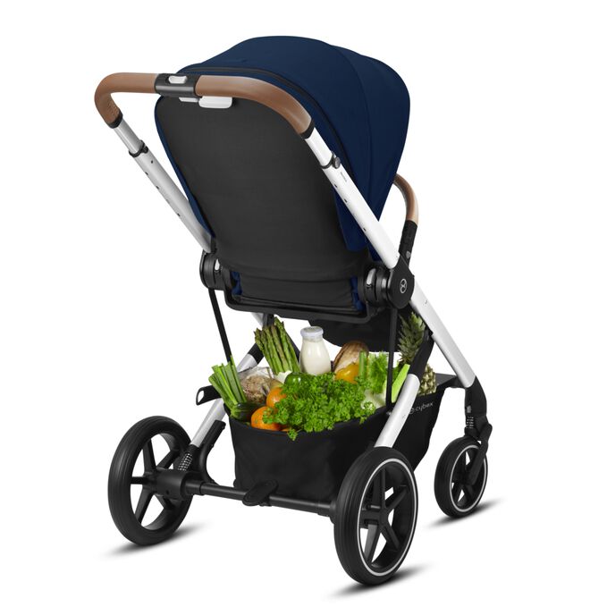 An image of the CYBEX Gold Balios S Lux 1 Stroller, highlighting the Spacious shopping basket feature.