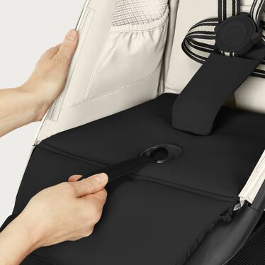An image of the CYBEX Gold Avi Spin Stroller, highlighting the One-pull Harness feature.