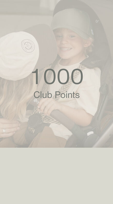 A child in a CYBEX buggy, but on the forefront of the picture, it says "100 Club Points"