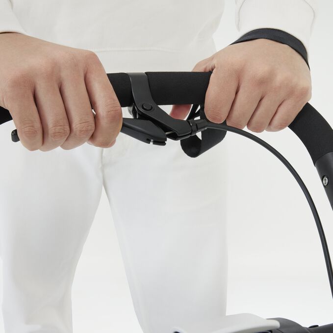 An image of the CYBEX Gold Avi Spin Stroller, highlighting the Adjustable Handle With Deceleration Brake feature.