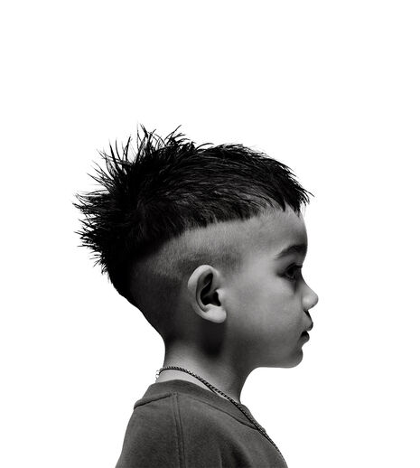 A young boy in sideview.