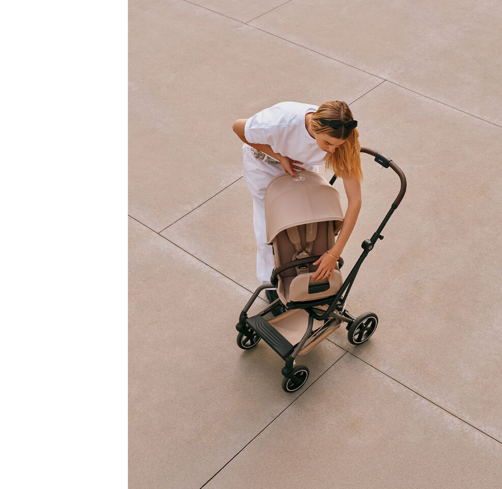 A woman turning her Eezy S Twist +2 buggy.