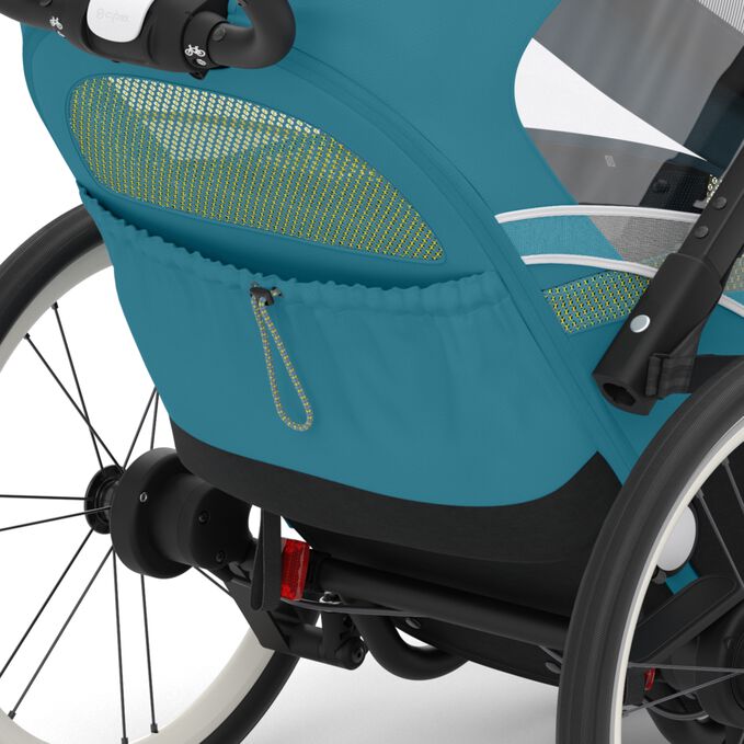 An image of the CYBEX Gold Zeno Bike Bike Trailer, highlighting the Convenient storage options feature.