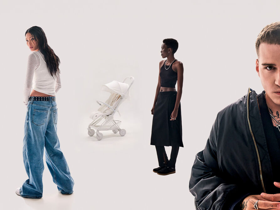A group of three people in fashionable clothing stands against a white background.