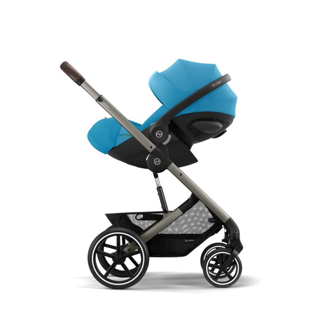 An image of the CYBEX Gold Cloud G i-Size Infant Car Seat, highlighting the Easy transition from car to stroller feature.