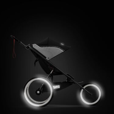 An image of the CYBEX Gold Avi One Box - PUMA Black Jogger, highlighting the Spotted in the dark feature.