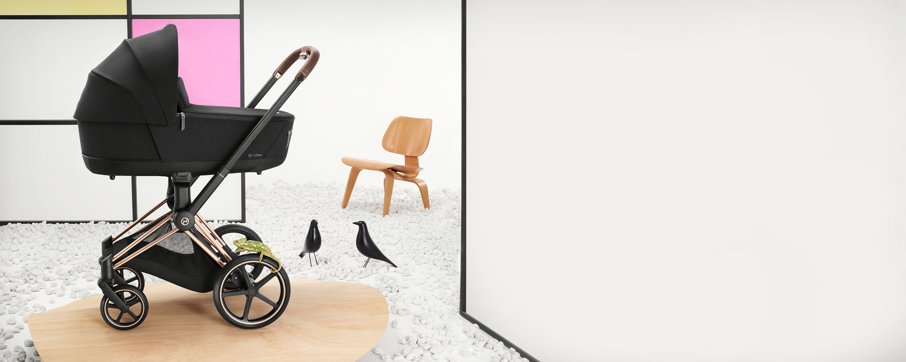 Luxury Priam stroller in a modern room with wooden furniture and decorations.