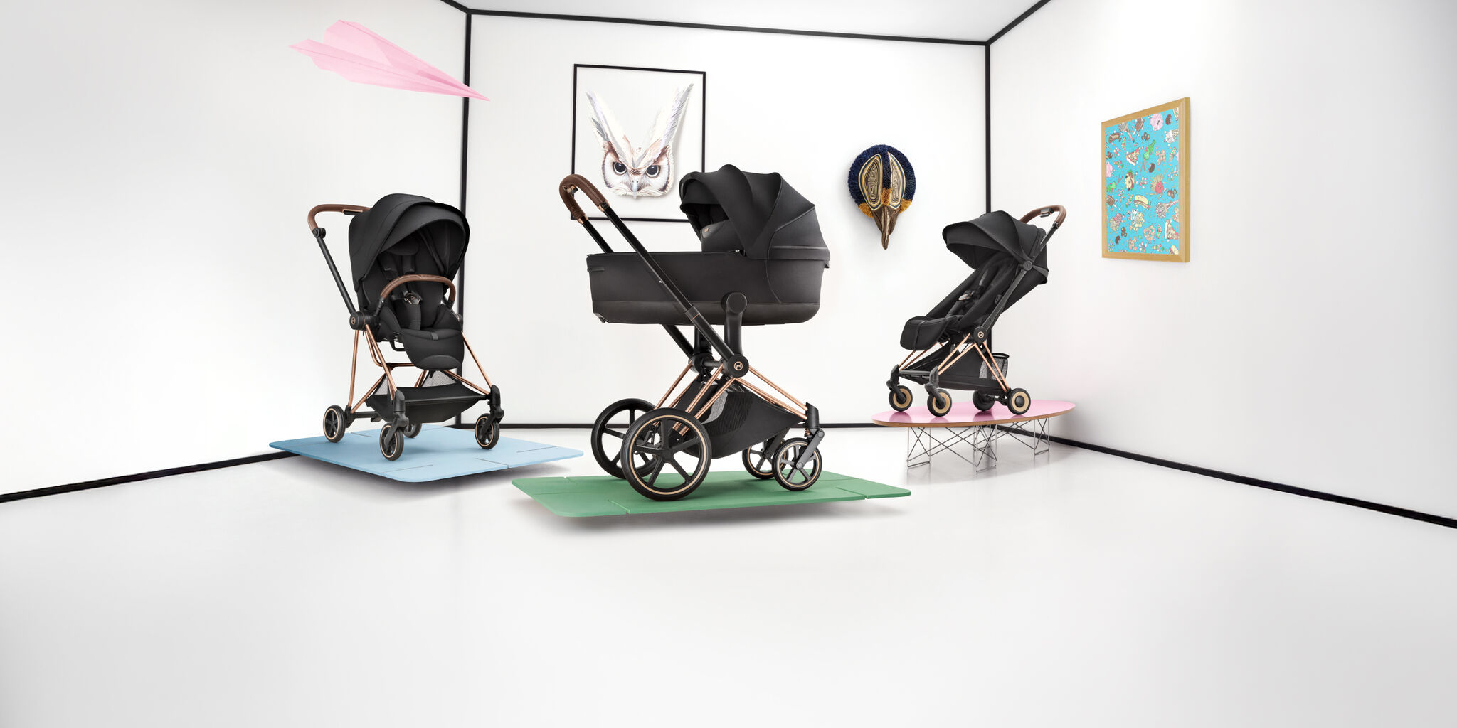 Three CYBEX Platinum strollers, on the left and right are one with a seat pack, in the middle is one with a Cot.