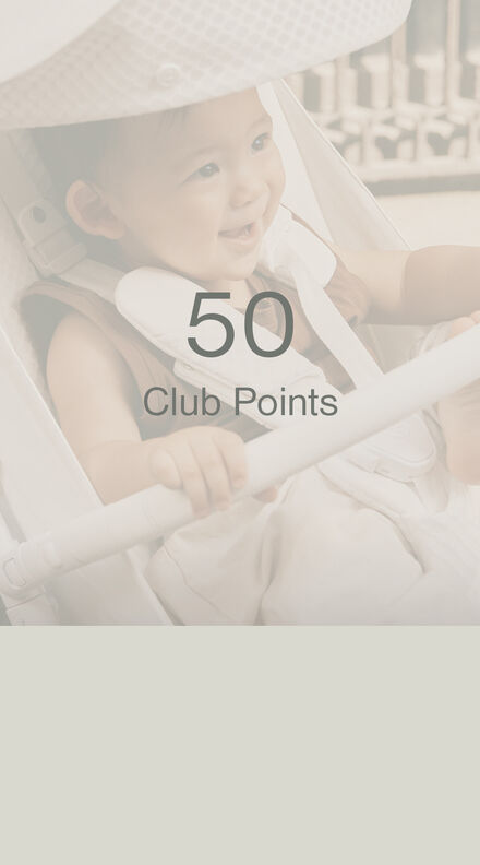 A child sitting in a CYBEX buggy, but in the forefront of the picture, it says "50 Club Points"