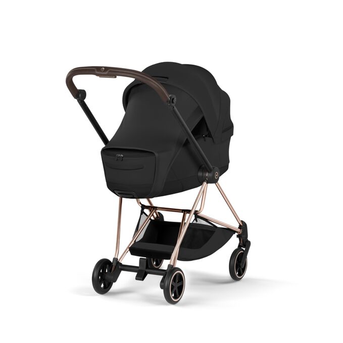 An image of the CYBEX Platinum Mios/Coya Fold Lux Carry Cot - Style Collection Stroller, highlighting the Extended Sun Canopy with Integrated Sun Sail and Visor feature.
