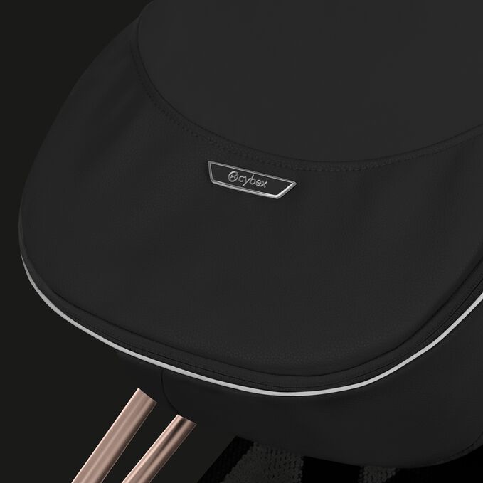 An image of the CYBEX Platinum Platinum Footmuff Accessories for Strollers, highlighting the Reflective Piping feature.