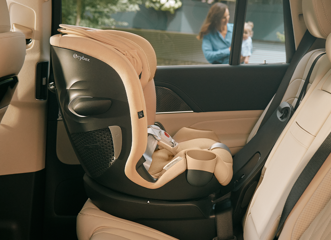 A child car seat installed in the back seat of a car.