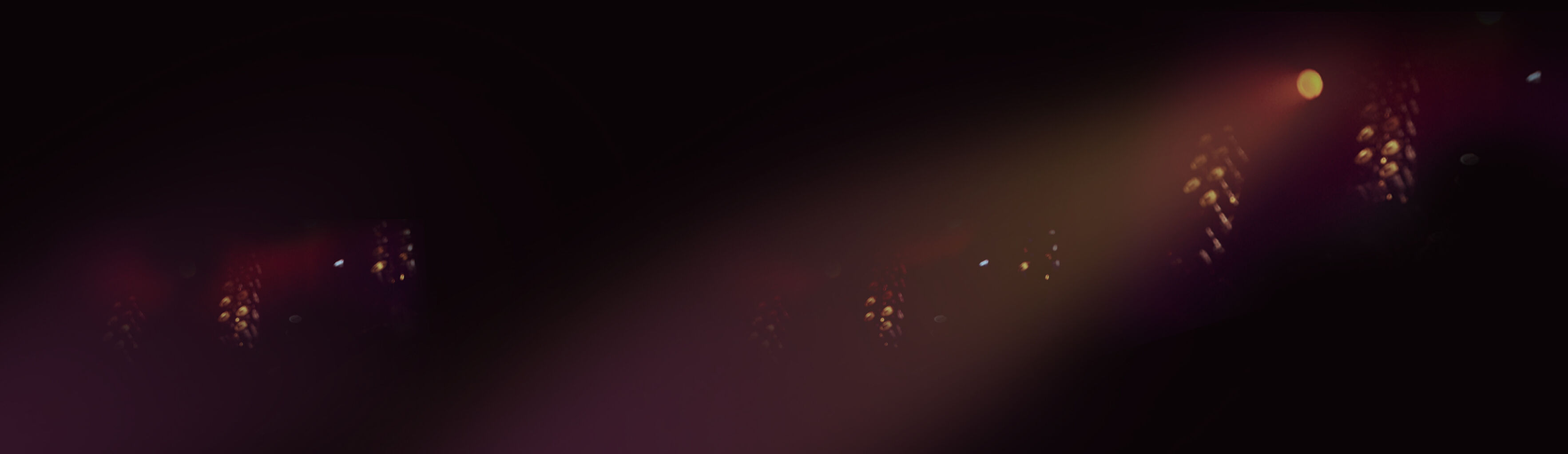 Dark, blurred lights in a concert setting.