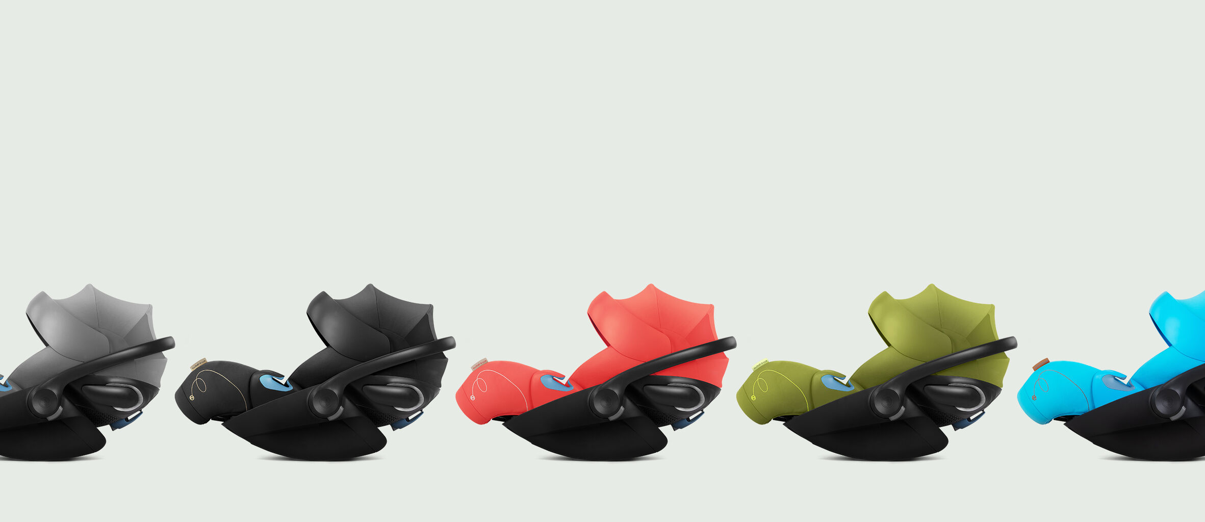 Cloud G reclining infant car seats in various colours lined up side by side.