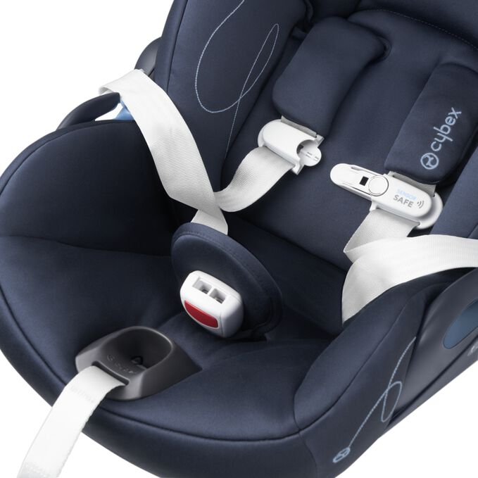 An image of the CYBEX Gold Cloud G Lux with Load Leg Base Infant Car Seat, highlighting the Easy-In Buckle Pad feature.