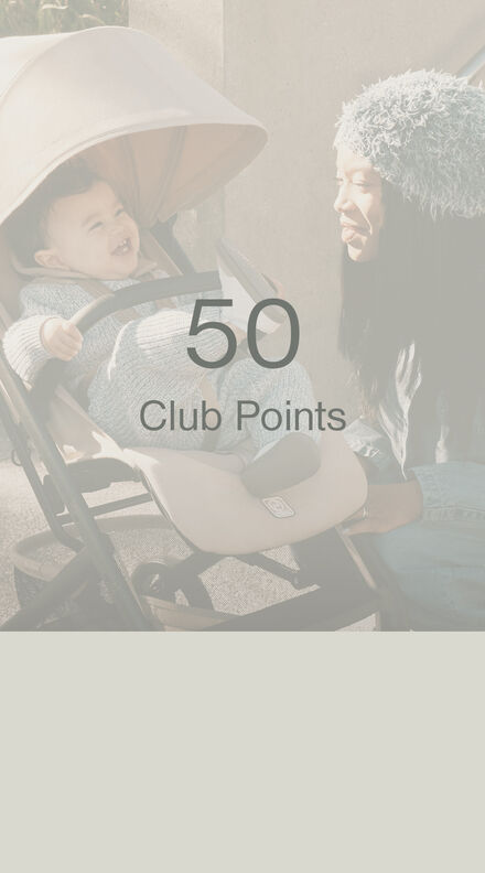 A child sitting in a CYBEX buggy, but in the forefront of the picture, it says "50 Club Points"