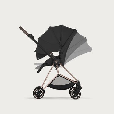 An image of the CYBEX Platinum Mios Stroller, highlighting the Ergonomic Near-Flat with XXL extendable Canopy feature.