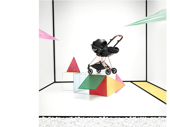 A CYBEX Mios stroller with an infant car seat attached.