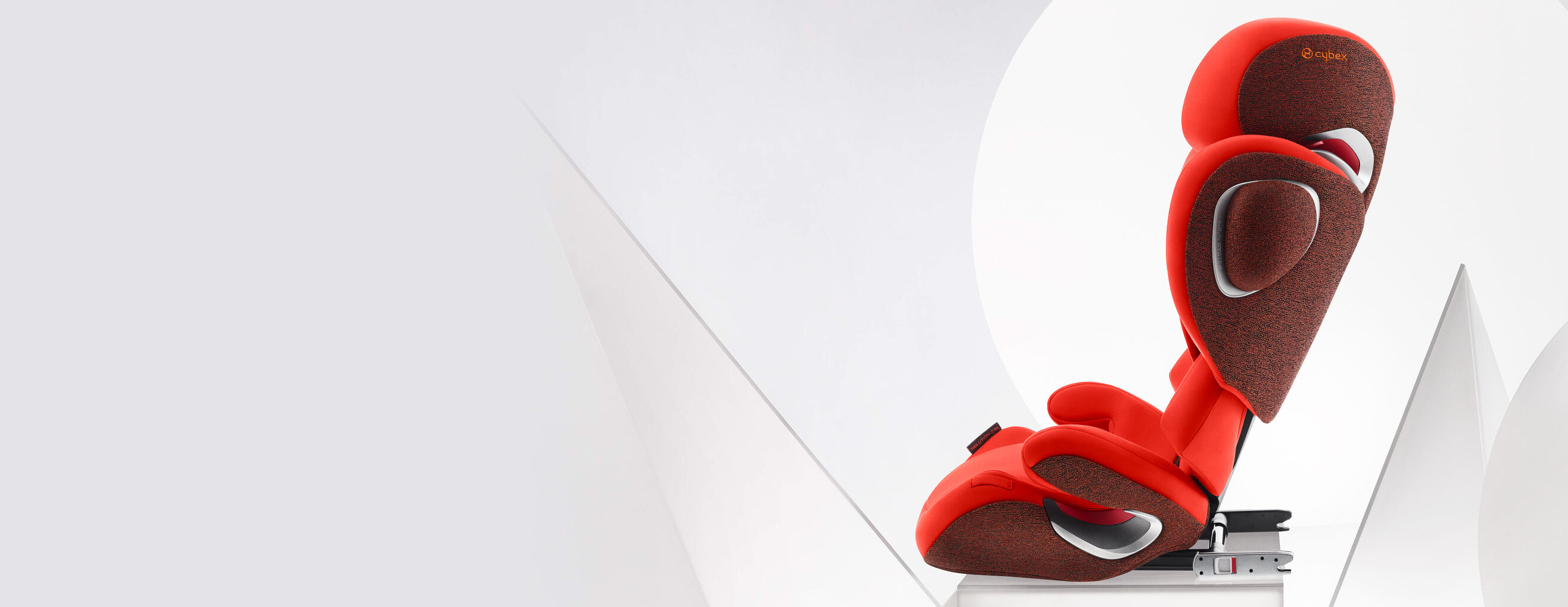 Red Solution Z booster car seat with modern design on a light background.