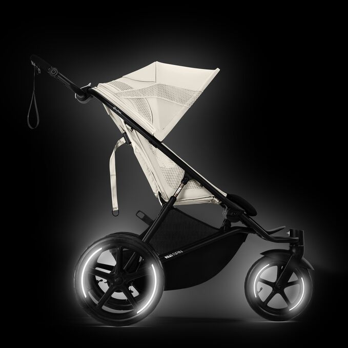 An image of the CYBEX Gold Avi Spin Stroller, highlighting the Reflective Rings and Stitches feature.
