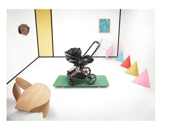 A CYBEX Platinum stroller with an infant car seat attached.