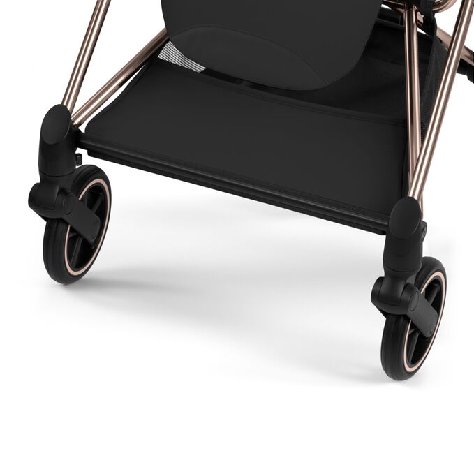 An image of the CYBEX Platinum Mios - Style Collection Stroller, highlighting the Large Color-matching Shopping Basket feature.
