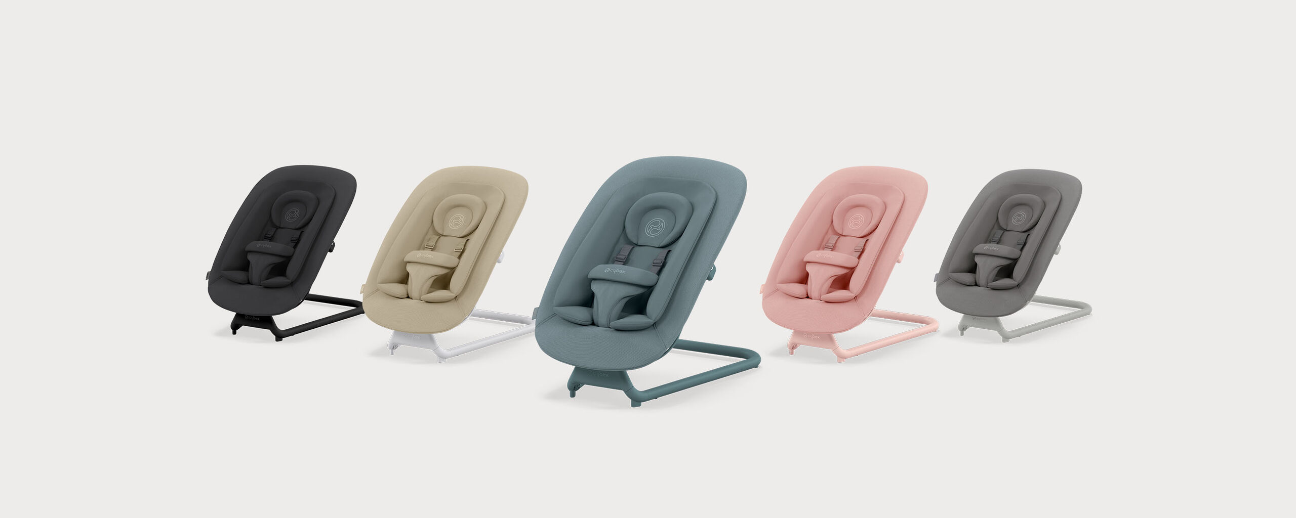 Five baby bouncers in different colours, from left to right: black, beige, blue, pink, and grey.