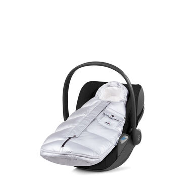 A silver footmuff in a black baby car seat.
