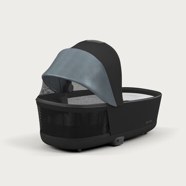 An image of the CYBEX Platinum Priam 4 Lux Carry Cot Stroller, highlighting the Panorama and sky view windows feature.
