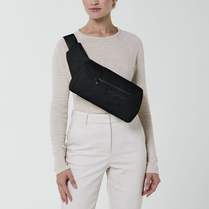 An image of the CYBEX Platinum Coya Carrier Bouclé Baby Carrier, highlighting the Trendy Crossbody Bag feature.
