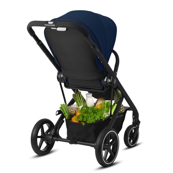 An image of the CYBEX Gold Balios S Lux Stroller, highlighting the Spacious shopping basket feature.