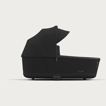 An image of the CYBEX Platinum Priam 4 Lux Carry Cot Stroller, highlighting the Sun canopy with integrated sun visor feature.