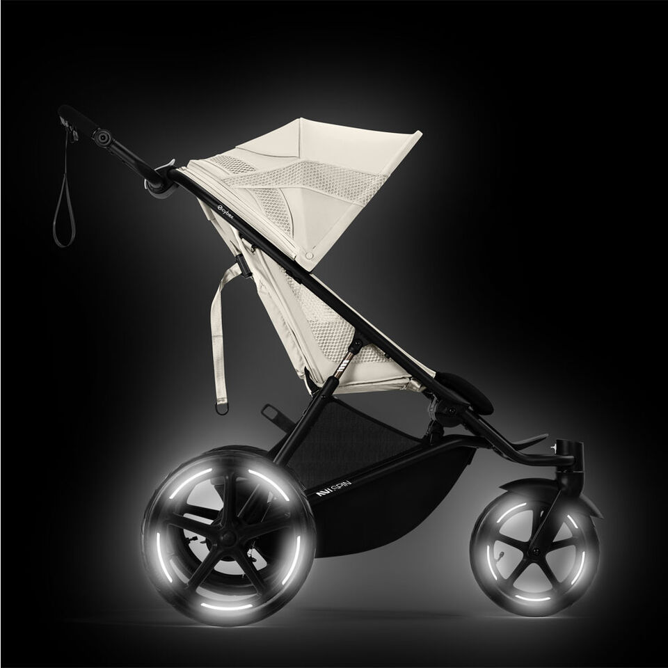 Product shot of an Avi Spin stroller with reflective lights on the wheels.