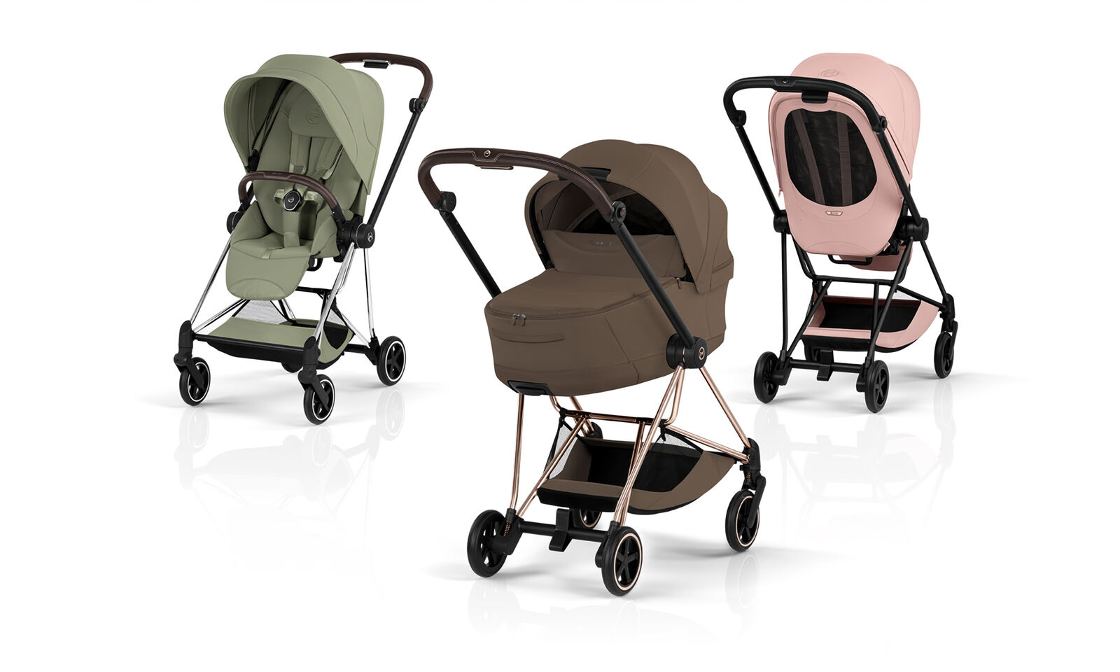 Three Mios Style strollers in different colors and with different attachments.